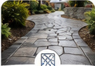 Decorative patterned concrete surface in a landscaped outdoor space