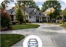 Finished residential concrete driveway curving toward a Middle Tennessee home