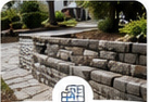 Residential retaining wall defining a landscaped change in grade