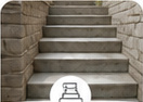 Finished concrete steps leading to a residential entrance